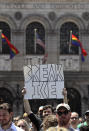 Wayfair employees and supporters rally at Copley Square in Boston, Wednesday, June 26, 2019. Employees at online home furnishings retailer Wayfair walked out of work to protest the company's decision to sell $200,000 worth of furniture to a government contractor that runs a detention center for migrant children in Texas. (AP Photo/Charles Krupa)