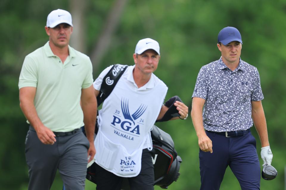Brooks Koepka of the United States, caddie Ricky Elliott, and Jordan Spieth of the United States walk the fifth hole during the second round of the 2024 PGA Championship at Valhalla Golf Club on May 17, 2024 in Louisville, Kentucky.
