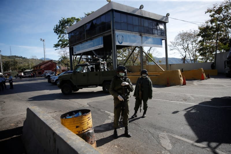 Members of the Bolivarian army stand at a checkpoint in response to the spread of coronavirus disease (COVID-19) in Caracas