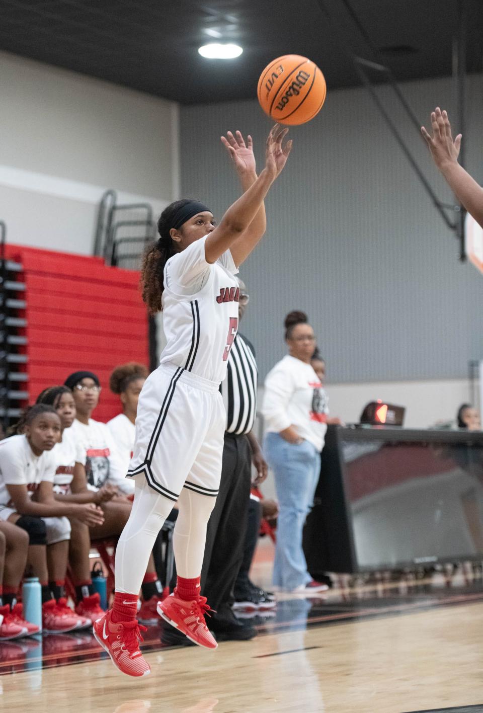 Jakya Brewton (5) sinks a 3-point shot during the Rutherford vs West Florida girls basketball game at West Florida High School in Pensacola on Monday, Jan. 15, 2024.