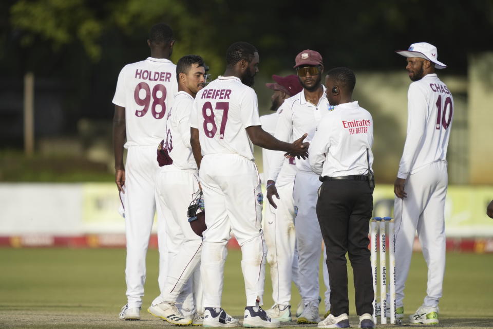 West Indies and Zimbabwean players shake hands at the end of play on the final day of the first Test cricket match between Zimbabwe and West Indies at Queens Sports Club in Bulawayo, Zimbabwe,Wednesday,Feb, 8, 2023. (AP Photo/Tsvangirayi Mukwazhi)