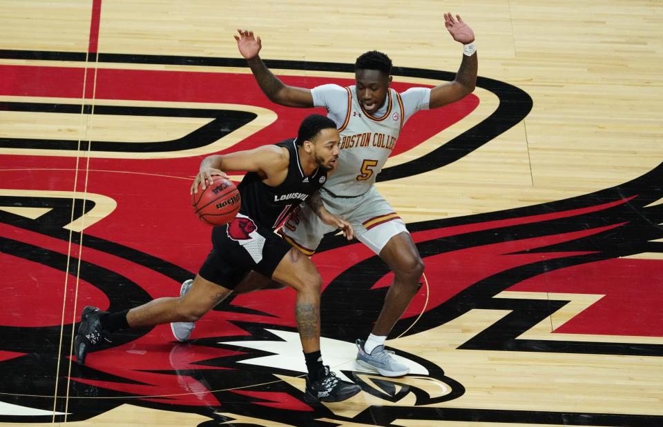 Louisville Cardinals guard Carlik Jones (1) drives the ball against Boston College Eagles guard Jay Heath (5) in the first half at at Conte Forum in Chestnut Hill, Massachusetts, on Saturday, Jan. 2, 2021.