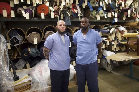 Inmates (L-R) Dino Robinson, 24, and Brandon Hargrose, 31, pose in the furniture shop during a media tour of the Curran-Fromhold Correctional Facility in Philadelphia, Pennsylvania, August 7, 2015. REUTERS/Mark Makela