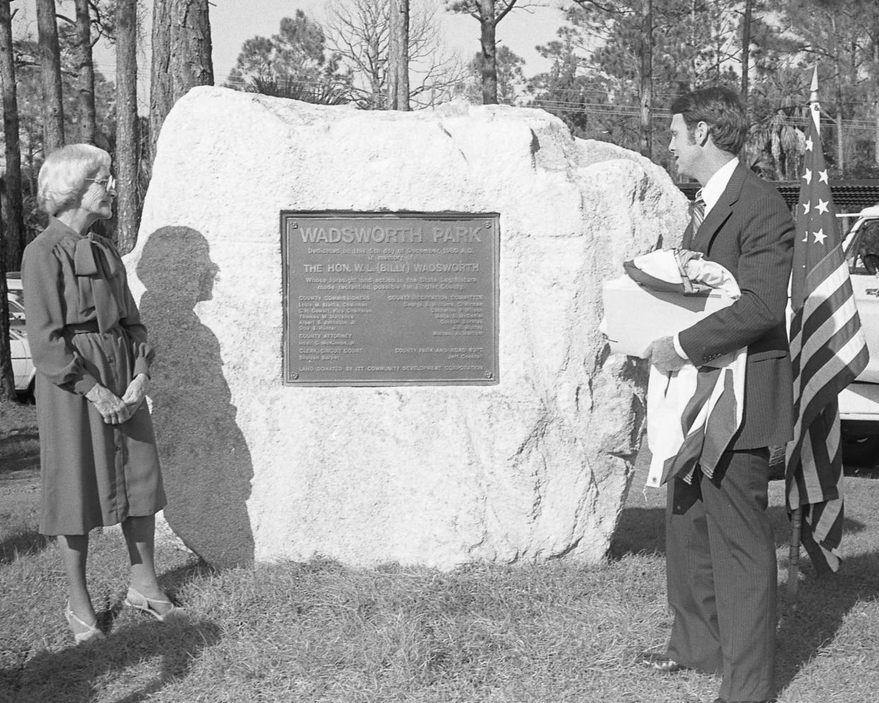 Frances Wadsworth, the widow of Billy Wadsworth, and Circuit Judge Kim Hammond, unveil the plaque at Wadsworth Park on Dec. 5, 1980, at the dedication of the park.