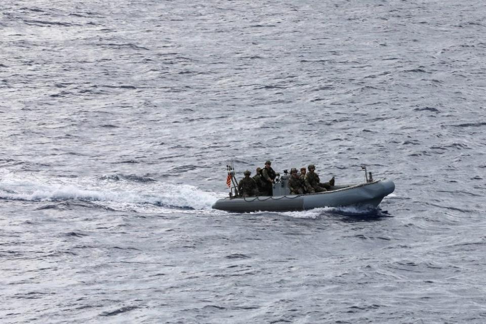US Coast Guard crew members patrol the Caribbean in a rigid hull inflatable boat