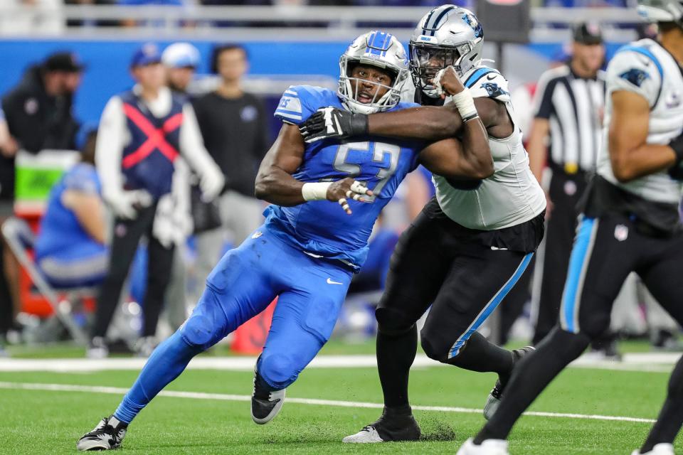 Lions defensive end Charles Harris looks to tackle Panthers quarterback Bryce Young during the second half of the Lions' 42-24 win on Sunday, Oct. 8, 2023, at Ford Field.