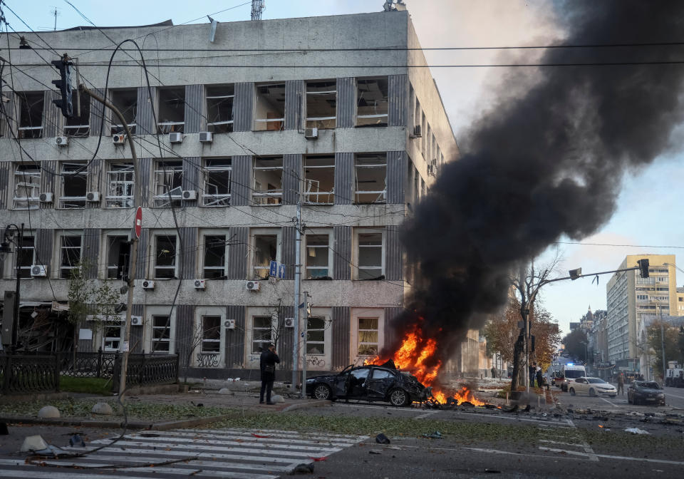 Cars burn after Russian military strike, as Russia's invasion of Ukraine continues, in central Kyiv, Ukraine October 10, 2022.  REUTERS/Gleb Garanich