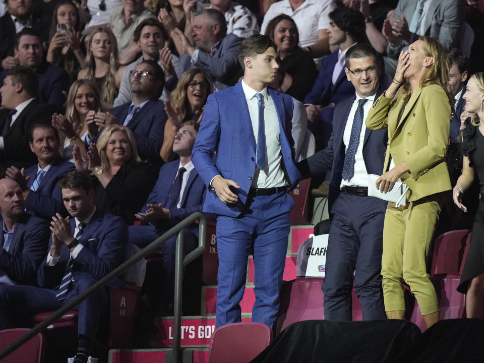 Juraj Slafkovsky and members of his family react after he was selected as the top pick by the Montreal Canadiens in the NHL hockey draft in Montreal on Thursday, July 7, 2022. (Ryan Remiorz/The Canadian Press via AP)