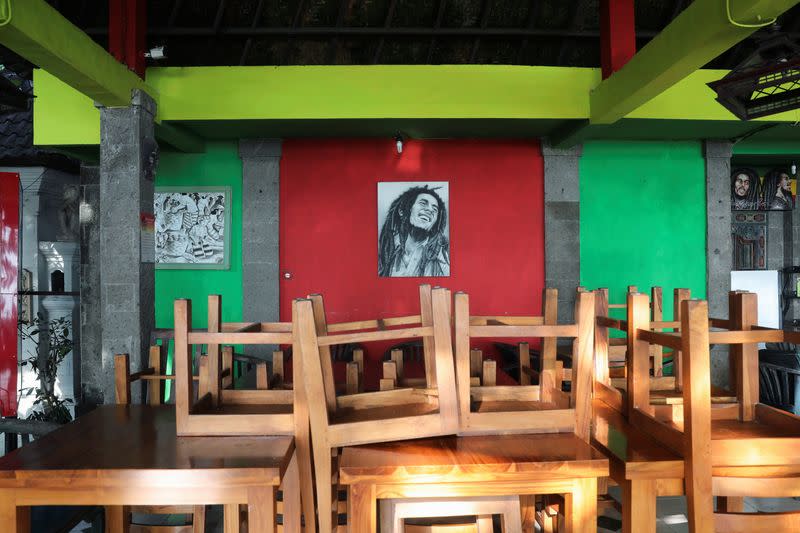 Chairs are seen at a restaurant closed temporarily amid the spread of coronavirus disease (COVID-19) outbreak, at Sanur beach in Bali