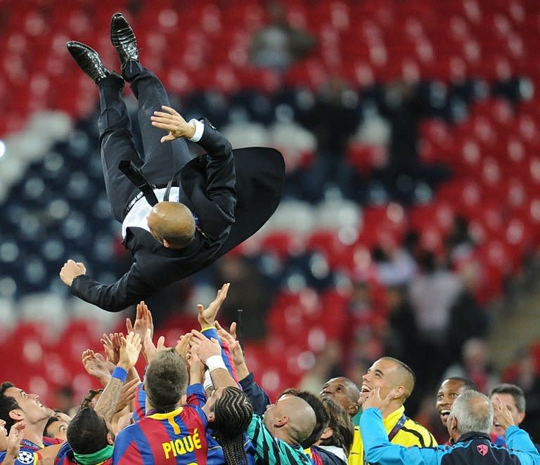 Barcelona's Spanish coach Josep Guardiola is put in the air in celebration at the end of the UEFA Champions League final football match FC Barcelona vs. Manchester United, on May 28, 2011 at Wembley stadium in London. Barcelona won 3 to 1