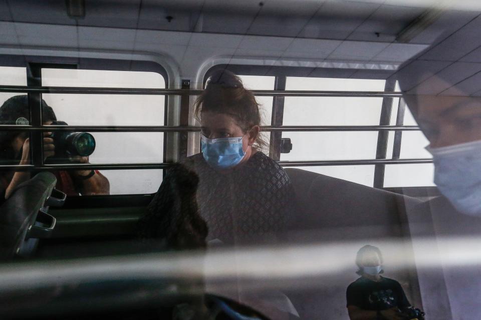 British national Samantha Jones, accused of killing her husband in 2018, is escorted by a police officer in a van after appearing in court in Alor Setar, in northern Malaysia, on August 3, 2020. - A British woman was jailed for three and a half years on August 3, after tearfully admitting she stabbed her husband to death during a fight on the Malaysian holiday island of Langkawi. (Photo by A. Ammarudin / AFP) (Photo by A. AMMARUDIN/AFP via Getty Images)