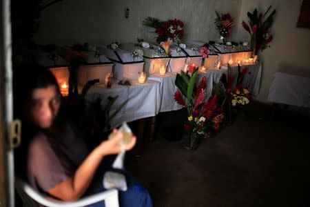 A woman attends the wake of people who died in the EL Mozote Massacre, in the village of La Joya, Meanguera, El Salvador, December 11, 2016. REUTERS/Jose Cabezas