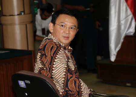 Jakarta Governor Basuki Tjahaja Purnama, popularly known as "Ahok", sits on the defendant's chair at the start of his trial hearing at North Jakarta District Court in Jakarta, Indonesia, Tuesday, Dec. 13, 2016. REUTERS/Tatan Syuflana/Pool