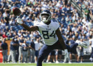 <p>Corey Davis #84 of the Tennessee Titans reaches for a pass from Marcus Mariota #8 against the Philadelphia Eagles during the first quarter at Nissan Stadium on September 30, 2018 in Nashville, Tennessee. (Photo by Silas Walker/Getty Images) </p>