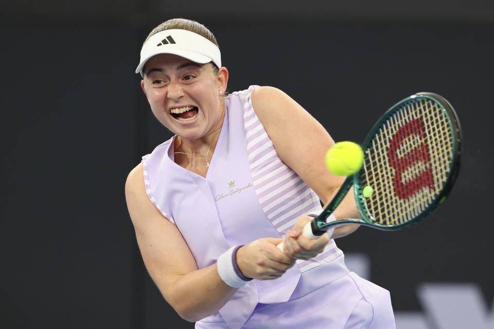 Jelena Ostapenko of Latvia plays a shot in her quarter-final match against Victoria Azarenka of Belarus during the Brisbane International tennis tournament in Brisbane, Australia, Friday, Jan. 5, 2024. (AP Photo/Tertius Pickard)