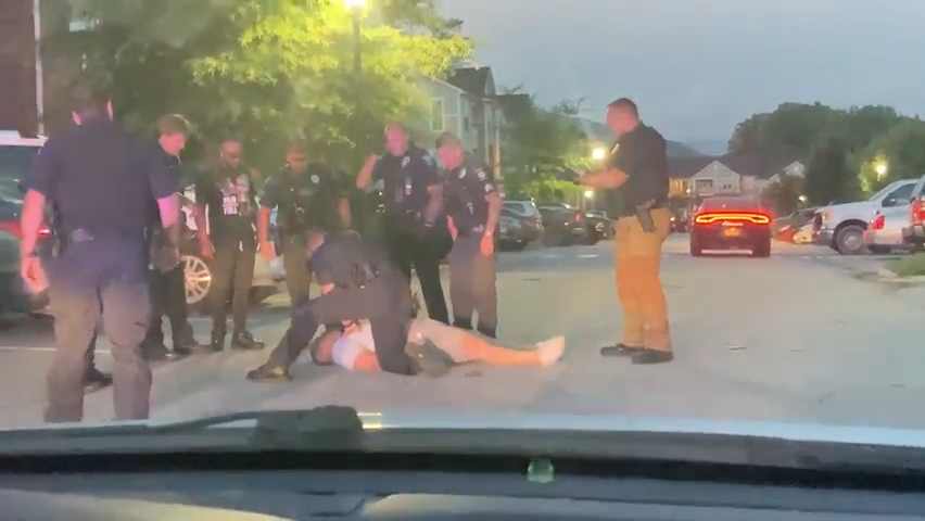 Christopher Hensley receives chest compressions after being pinned by officers in his Fletcher apartment complex.