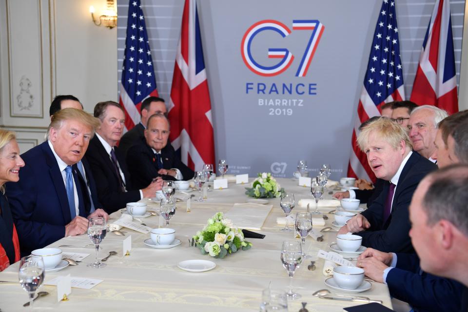 US President Donald Trump (2nd L) and Britain's Prime Minister Boris Johnson (3rd R) attend a working breakfast in Biarritz, south-west France on August 25, 2019, on the second day of the annual G7 Summit attended by the leaders of the world's seven richest democracies, Britain, Canada, France, Germany, Italy, Japan and the United States. (Photo by Nicholas Kamm / AFP)        (Photo credit should read NICHOLAS KAMM/AFP/Getty Images)