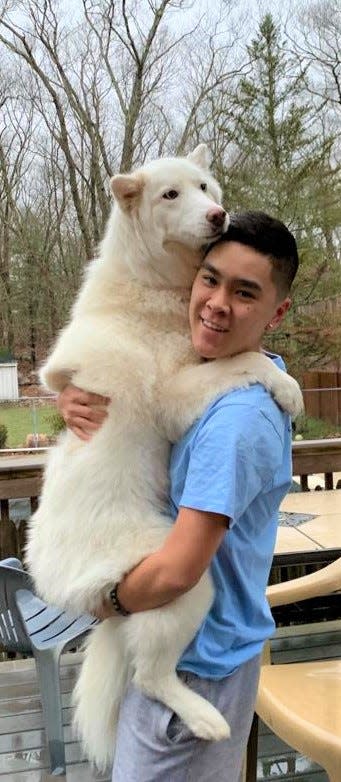 Anthony Lee, of Weymouth, with his best buddy Luna, the family's Siberian husky.