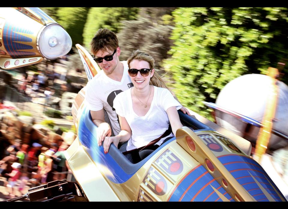 Chord Overstreet and Emma Roberts take a spin on the Astro Orbitor attraction at Disneyland on August 15, 2011 in Anaheim, California.   (Photo by Paul Hiffmeyer/Disney Parks via Getty Images)