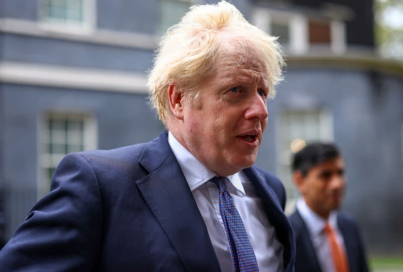 Britain's Prime Minister Boris Johnson and Chancellor of the Exchequer Rishi Sunak arrive for a Cabinet meeting, in London