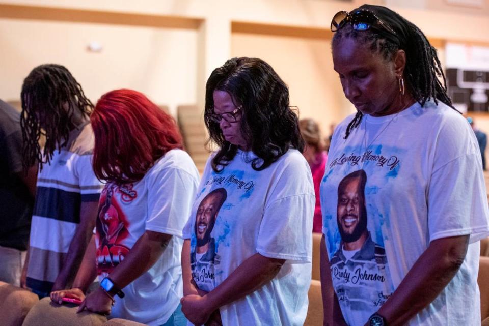 Family members of Randy Johnson pray during a candlelight ceremony as a part of National Crime Victims’ Rights Week at First Baptist Church of Gulfport on Tuesday, April 23, 2024. Randy Johnson, 41, was shot and killed on Sept. 18, 2021 at the Golden Nugget Casino in Biloxi.