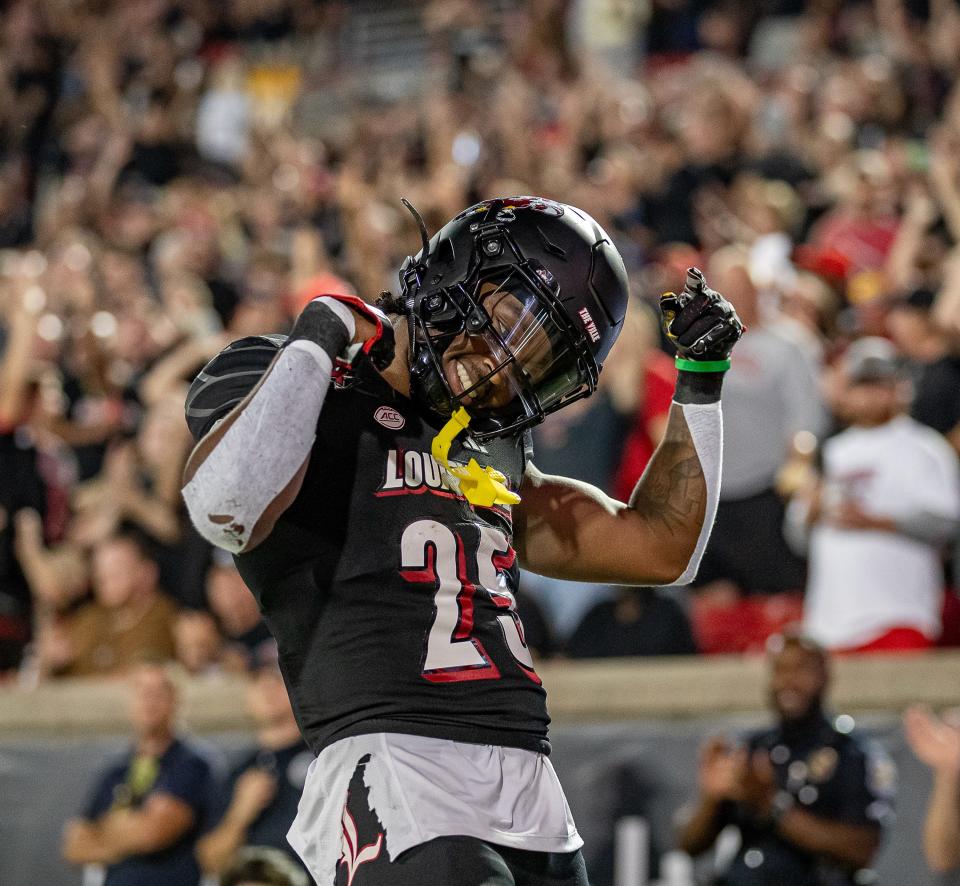 Louisville running back Jawhar Jordan (25) celebrated after running 72 yards for a score against the Murray State defense during first half action on Thursday, Sept. 7, 2023.