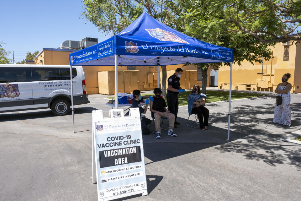 People receive COVID-19 vaccinations