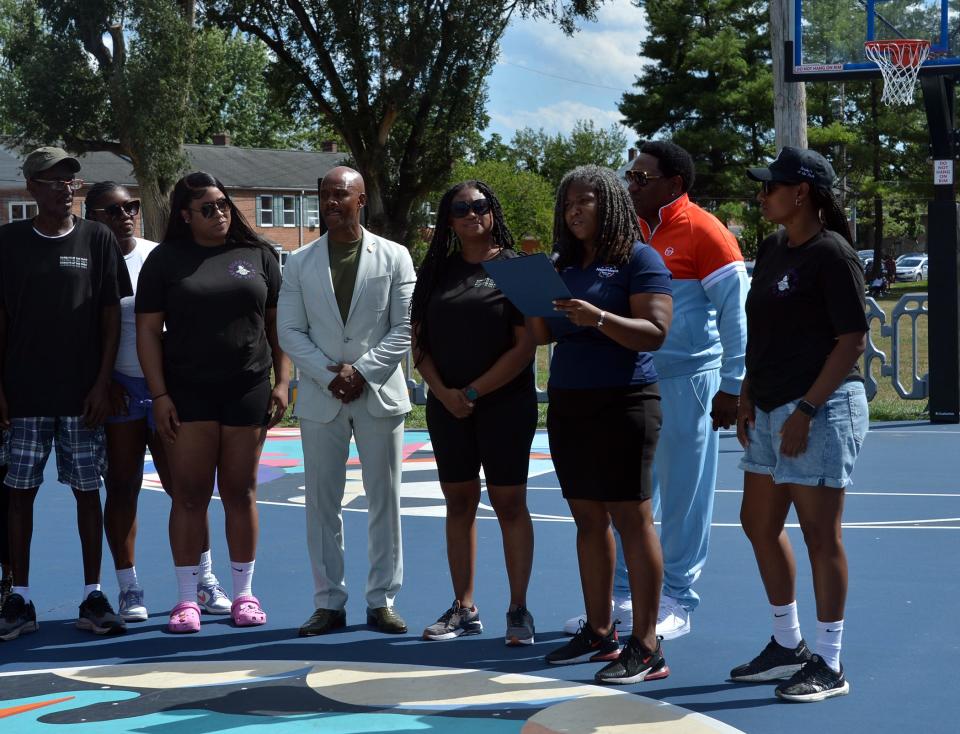 Hagerstown Mayor Tekesha A. Martinez, third from right, reads a Special Recognition and Appreciation proclamation during ceremonies at the start of opening day for the 60th anniversary season of the Ruthann V. Monroe Summer Basketball League on Sunday at Wheaton Park in downtown Hagerstown. At the far right is league commissioner Eb Williams.