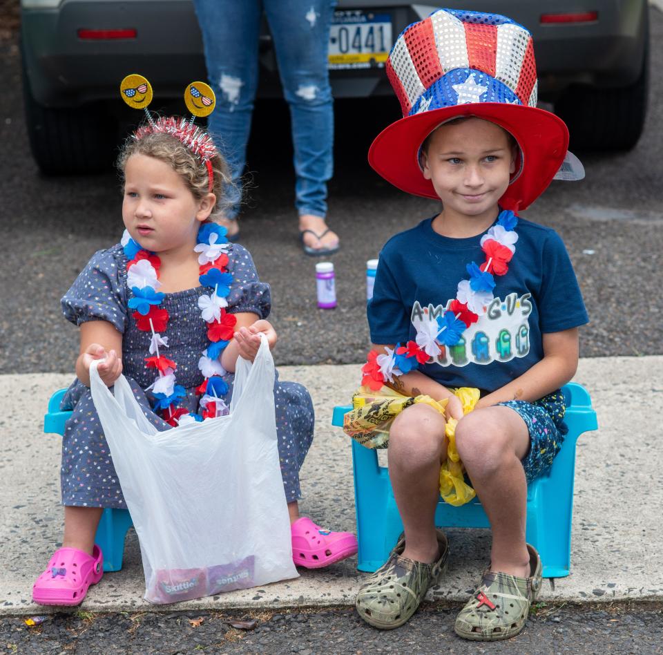 Sadie Little, 5, and Beau Little, 8, watch floats pass by during the 2021 Langhorne Borough Memorial Day Parade.