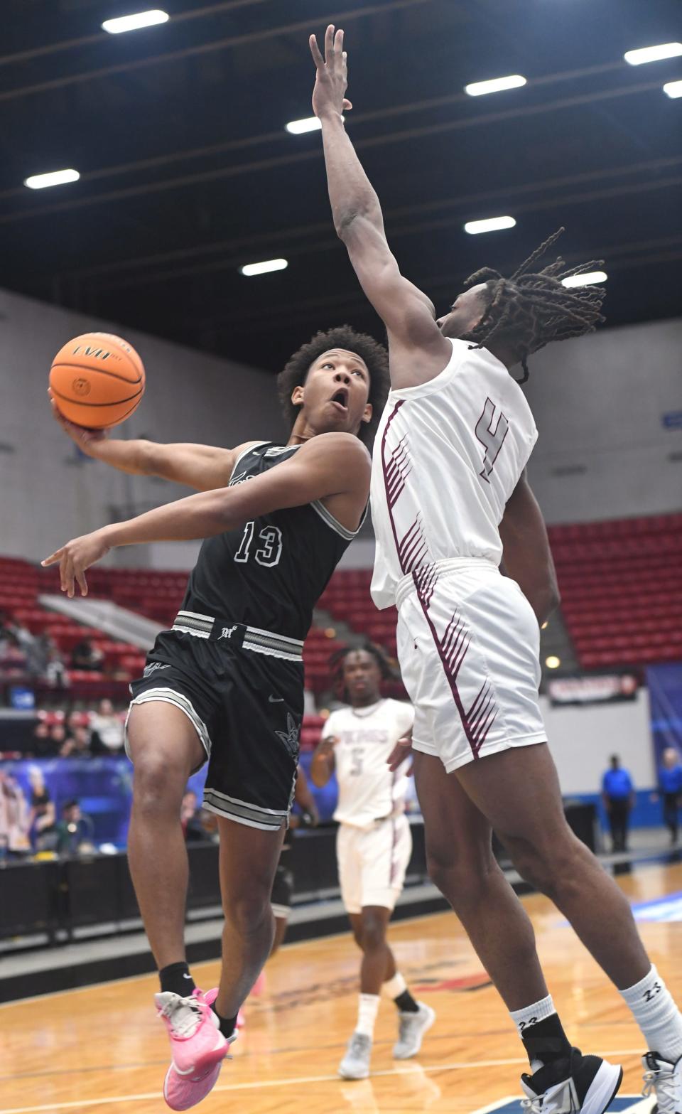 Mariner's Marcus Kelley, Jr. (13) shoots against Norland's Marcus Allen (4) in the Class 5A semifinal during the Florida High School State Championships at the RP Funding Center in Lakeland on Wednesday, March 6, 2024. Norland defeated Mariner 53-37.