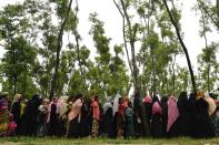 <p>Rohingya refugees wait in line for relief supplies in the refugee camp of Leda near Teknaf on Sept. 19, 2017.<br> (Photo: Dominique Faget/AFP/Getty Images) </p>