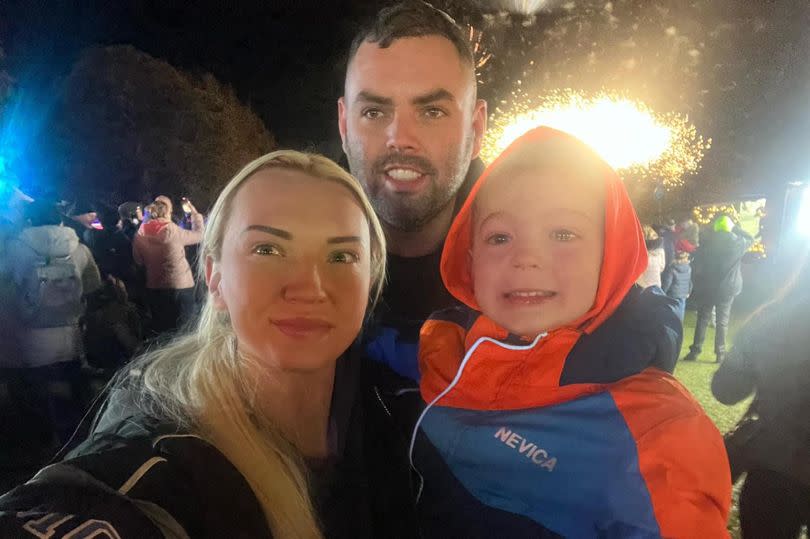 Rebecca Davis with her partner Kieran Forbes and their four-year-old son