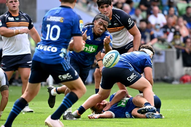 Auckland Blues scrum-half Taufa Funaki (C) scored two of his side's eight tries on Friday (William WEST)