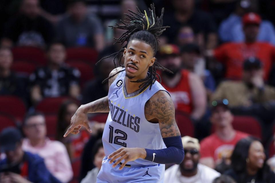 FILE - Memphis Grizzlies guard Ja Morant reacts after sinking a three-point shot against the Houston Rockets in the first half of an NBA basketball game Wednesday, March 1, 2023 in Houston.  This aggressive style of play helped the 23-year-old guard's meteoric rise to NBA stardom.  But his aggressive approach to basketball has seemingly affected his off-court lifestyle and marginalized him.  (AP Photo/Michael Wyke, file)