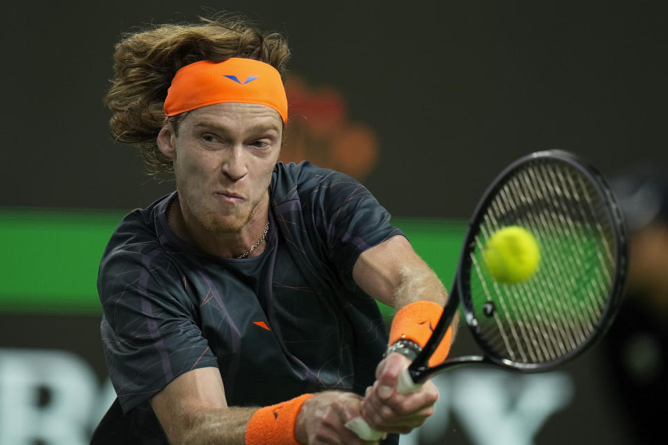 Andrey Rublev of Russia returns a shot to Ugo Humbert of France during the men's singles quarterfinal match of the Shanghai Masters tennis tournament at Qizhong Forest Sports City Tennis Center in Shanghai, China, Friday, Oct. 13, 2023. (AP Photo/Andy Wong)