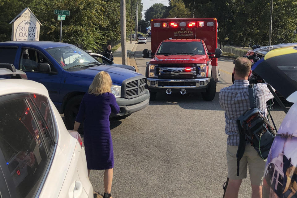 An ambulance leaves the scene shooting in Memphis, Tenn., on Wednesday, Sept. 18, 2019. Officials say two deputies have been injured and a suspect has died in the shooting. (AP Photo/Adrian Sainz)