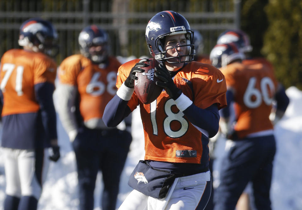 Denver Broncos quarterback Peyton Manning (18) passes during practice Wednesday, Jan. 29, 2014, in Florham Park, N.J. The Broncos are scheduled to play the Seattle Seahawks in the NFL Super Bowl XLVIII football game Sunday, Feb. 2, in East Rutherford, N.J. (AP Photo/Mark Humphrey)