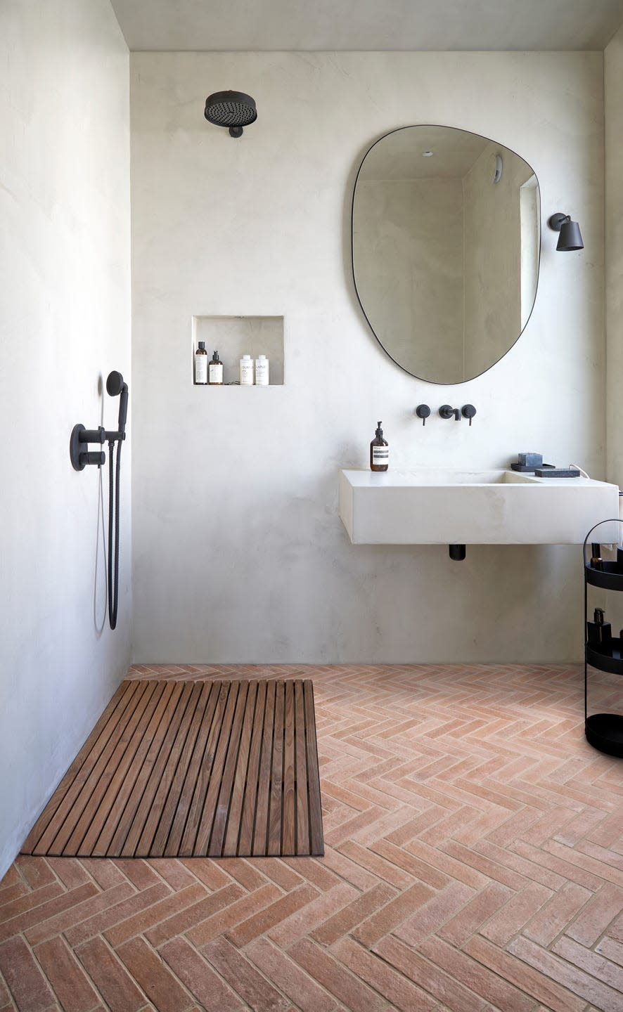 camouflage shower niche in a wetroom with matt black hardware