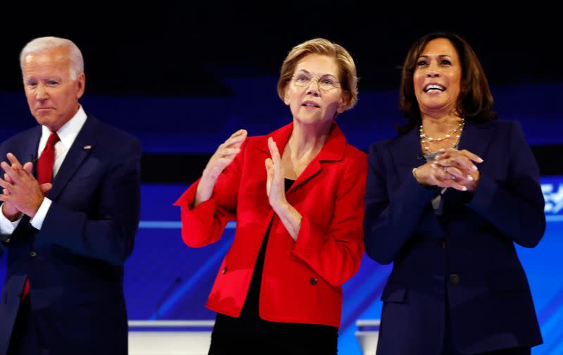 Former Vice President Joe Biden, Senator Elizabeth Warren and Senator Kamala Harris stand onstage at the start of the 2020 Democratic U.S. presidential debate in Houston