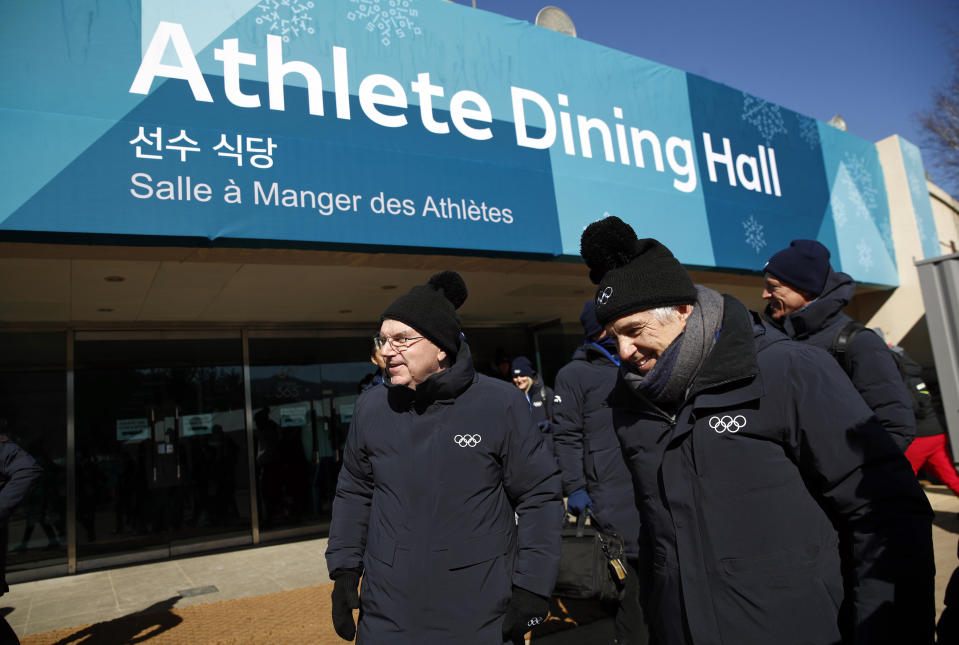 <p>International Olympic Committee President Thomas Bach, left, tours the PyeongChang Olympic Village with IOC officials prior to the 2018 Winter Olympics in PyeongChang, South Korea. (Patrick Semansky/AP) </p>