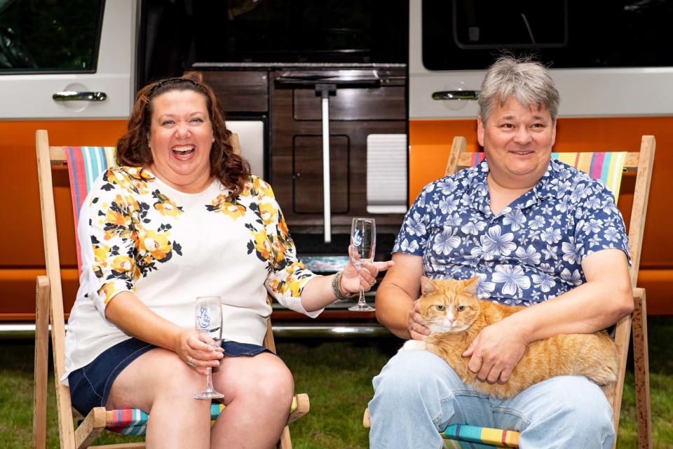 Paula and Andrew Hancock, along with their cat Shortcake, toast a year since they scooped a £1 million lottery scratchcard prize win, at The Pumping House in Ollerton, Nottinghamshire: PA