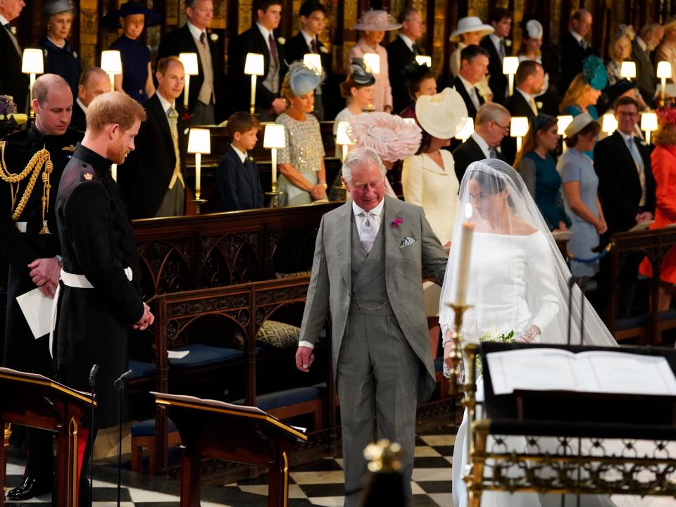 Prince William, Prince Harry, King Charles III, and Meghan Markle at Harry and Meghan's wedding at Windsor Castle on May 19, 2018.