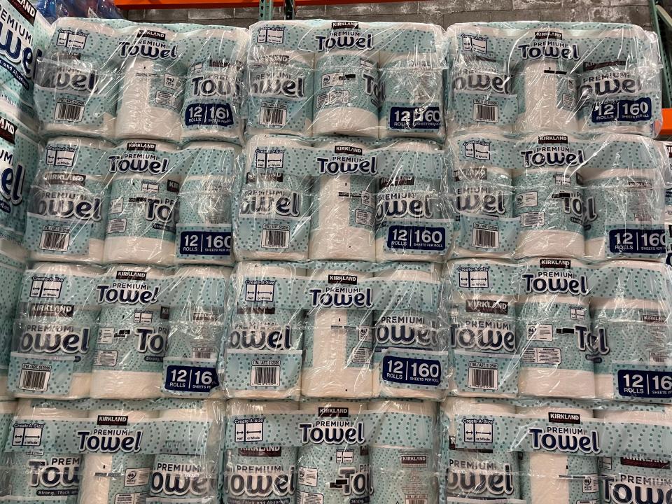 huge stack of blue and white packages of paper towels at costco