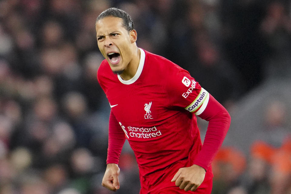 Liverpool's Virgil van Dijk celebrates after scoring his side's first goal during the English Premier League soccer match between Liverpool and Luton Town, at Anfield stadium in Liverpool, England, Wednesday, Feb. 21, 2024. (AP Photo/Jon Super)