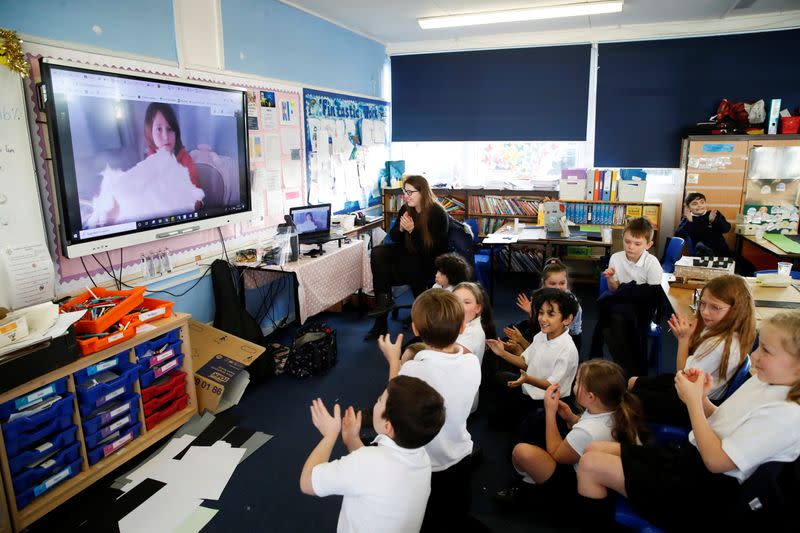 Students at Holne Chase School interact with a class member via the internet