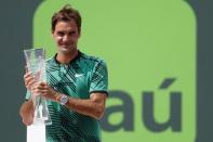 Apr 2, 2017; Key Biscayne, FL, USA; Roger Federer of Switzerland holds the Butch Buchholz trophy after his match against Rafael Nadal of Spain (not pictured) in the men's singles championship of the 2017 Miami Open at Crandon Park Tennis Center. Federer won 6-3, 6-4. Mandatory Credit: Geoff Burke-USA TODAY Sports