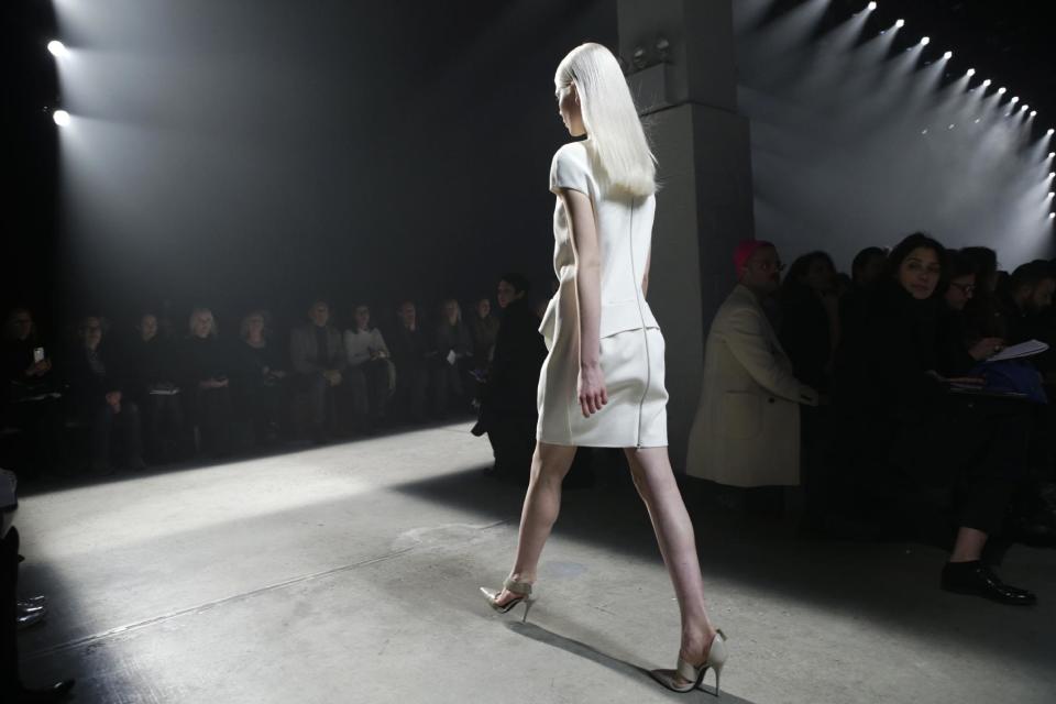 A model walks the runway during the showing of the Narciso Rodriguez Fall 2014 collection at Fashion Week in New York, Tuesday, Feb. 11, 2014. (AP Photo/Kathy Willens)