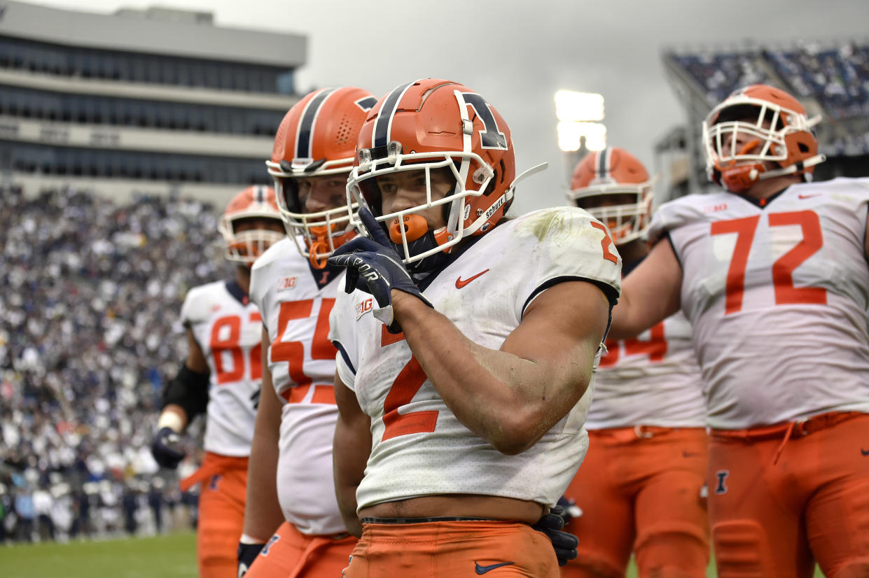 UNIVERSITY PARK, PA - OCTOBER 23: Illinois running back Chase Brown (2) celebrates with teammates after a touchdown that was called back during the Illinois versus Penn State college football game on October 23, 2021 at Beaver Stadium in University Park, PA. (Photo by Randy Litzinger/Icon Sportswire via Getty Images)