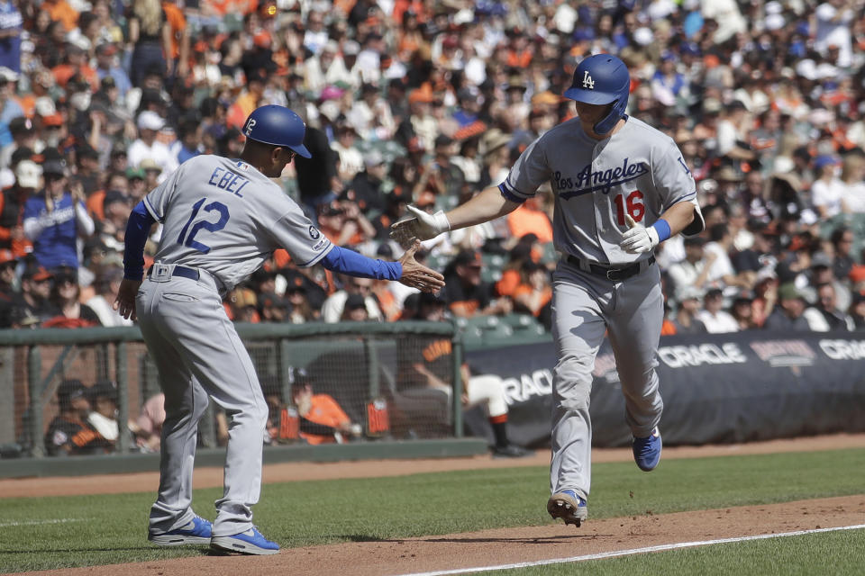 Los Angeles Dodgers' Will Smith, right, is congratulated by third base coach Dino Ebel (12) after hitting a two-run home run against the San Francisco Giants during the first inning of a baseball game in San Francisco, Sunday, Sept. 29, 2019. (AP Photo/Jeff Chiu)