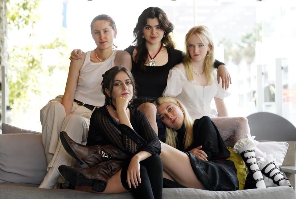 Lizzie Mayland, clockwise from top left, Abigail Morris, Emily Roberts, Georgia Davies and Aurora Nishevci of the indie rock band The Last Dinner Party pose for a portrait, Tuesday, Nov. 7, 2023, at the AC Hotel by Marriott in Los Angeles. (AP Photo/Chris Pizzello)